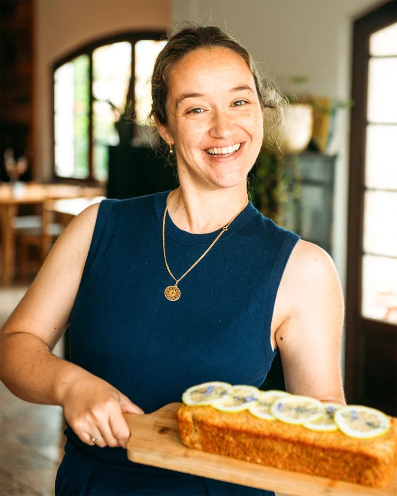 Staff member Liliana serving vegan cake