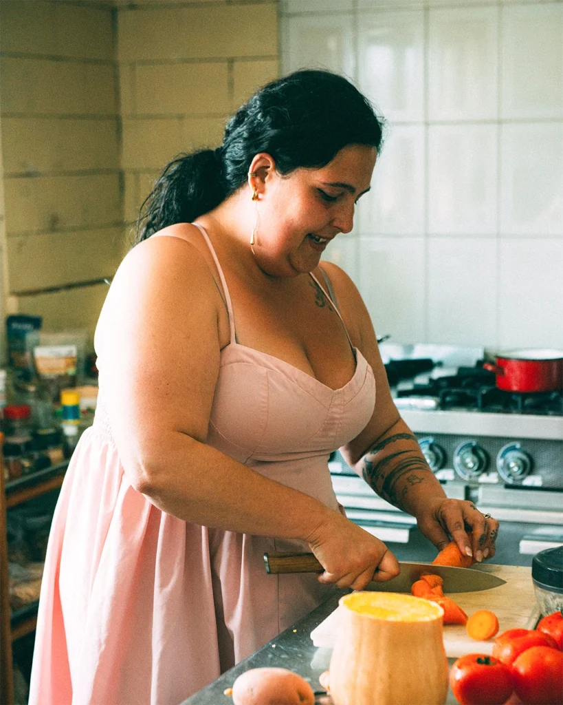 Staff member Mariana, chopping vegetables