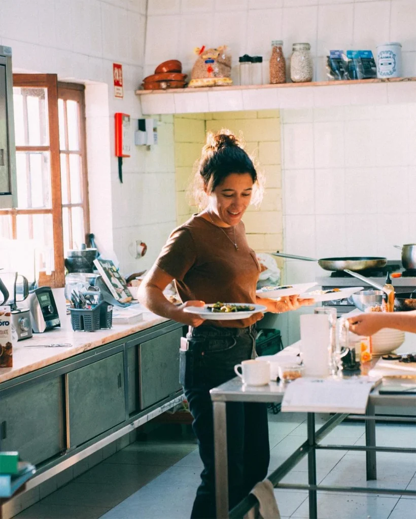 Staff member Susana, preparing dishes